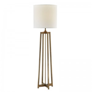 Tolg óstán hyatt in aice le lampa urláir le bailchríoch óir seanda ag an seomra aoi